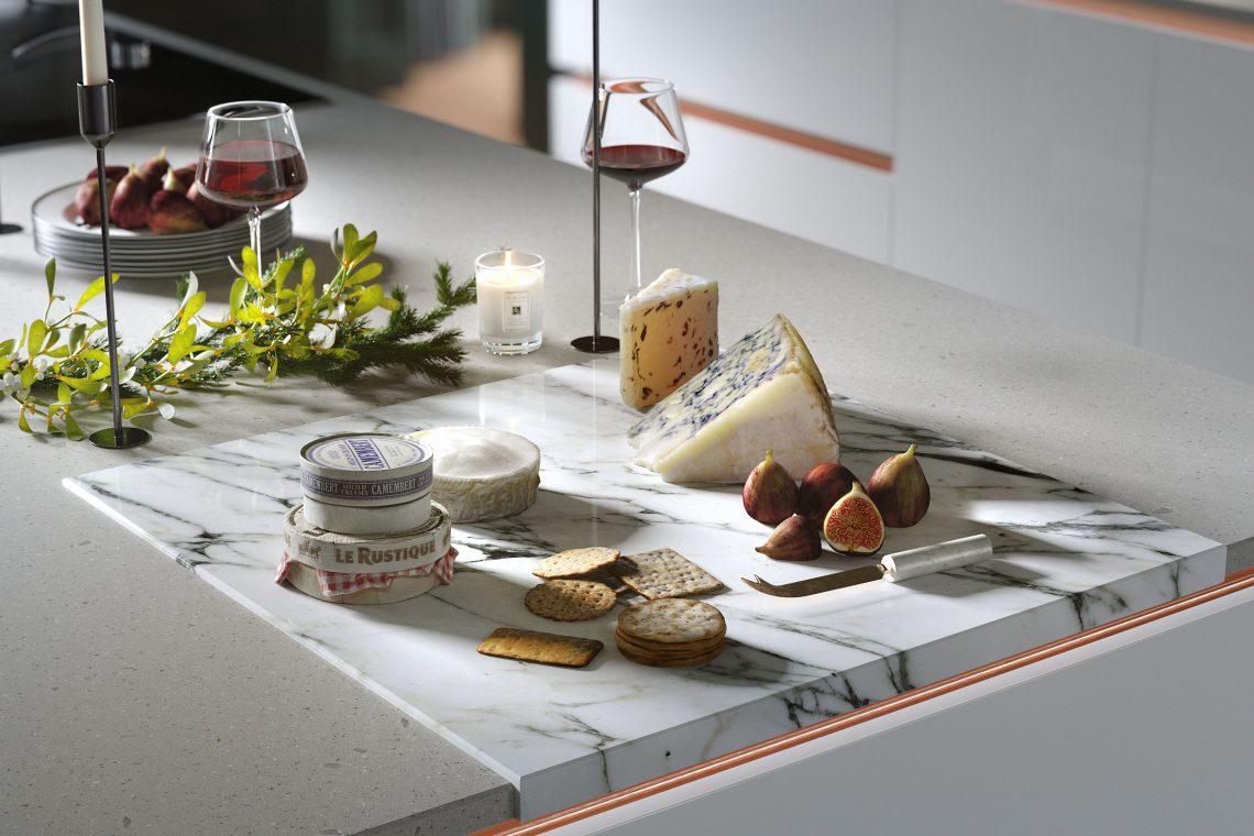 Wren Kitchens cheese and wine selection on a quartz worktop